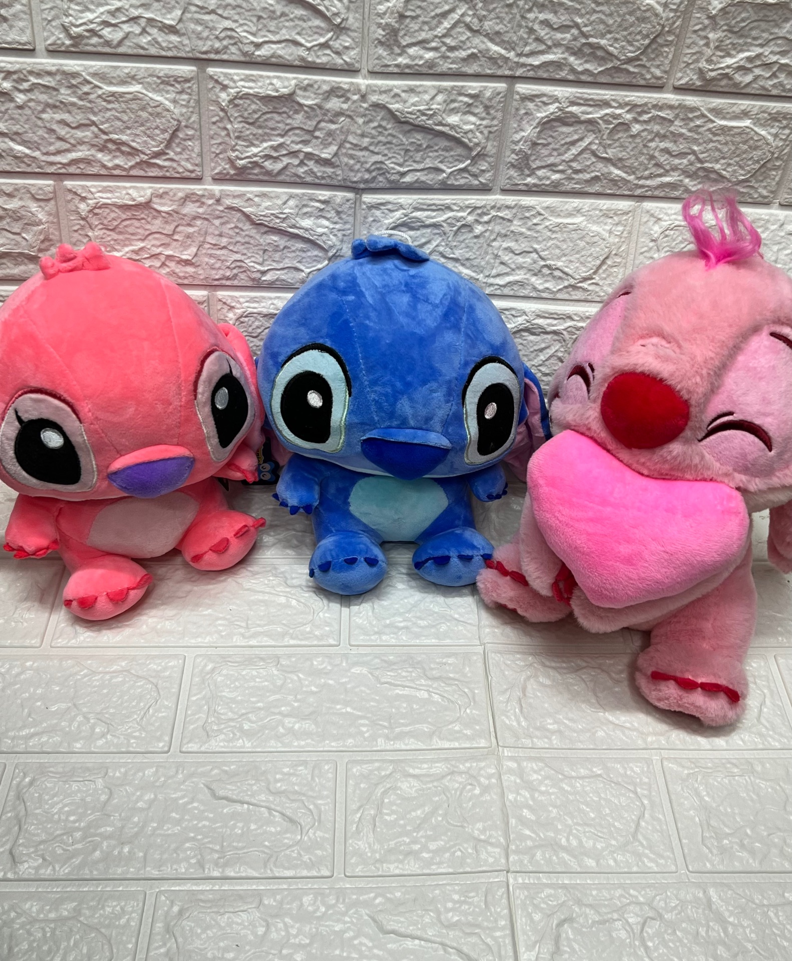 Peluches de Stich y Angela